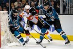 SAN JOSE, CA - FEBRUARY 08:  Benn Ferriero #78 of the San Jose Sharks takes control of the puck away from teammate Ryane Clowe #29 and Chris Butler #44 of the Calgary Flames at HP Pavilion at San Jose on February 8, 2012 in San Jose, California.  (Photo by Thearon W. Henderson/Getty Images)