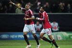 MILAN, ITALY - FEBRUARY 15:  Robinho of AC Milan celebrates his second goal with Kevin-Prince Boateng of AC Milan during the UEFA Champions League round of 16 first leg match between AC Milan and Arsenal at Stadio Giuseppe Meazza on February 15, 2012 in Milan, Italy.  (Photo by Shaun Botterill/Getty Images)