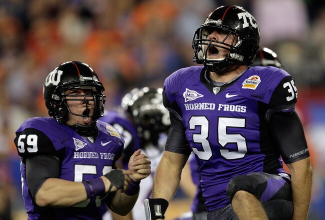GLENDALE, AZ - JANUARY 04:  (R-L) Tanner Brock #35 and Logan Sligar #59 of the TCU Horned Frogs react after making a tackle in the first half against the Boise State Broncos during the Tostitos Fiesta Bowl at the Universtity of Phoenix Stadium on January 4, 2010 in Glendale, Arizona.  (Photo by Jamie Squire/Getty Images)