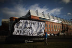 GLASGOW, SCOTLAND - FEBRUARY 15:  Rangers fan Michael Haggerty displays a banner outside directed to club owner Craig Whyte, outside the Ibrox Stadium on February 15, 2012 in Glasgow, Scotland. The Clydesdale Bank Premier League club entered administration yesterday over an unpaid tax bill of 9 million GBP.  (Photo by Jeff J Mitchell/Getty Images)