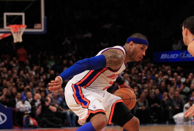 NEW YORK, NY - JANUARY 31:  Carmelo Anthony #7 of the New York Knicks drives against Austin Daye #5 of the Detroit Pistons at Madison Square Garden on January 31, 2012 in New York City.  NOTE TO USER: User expressly acknowledges and agrees that, by downloading and or using this photograph, User is consenting to the terms and conditions of the Getty Images License Agreement. (Photo by Chris Trotman/Getty Images)