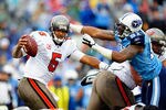 NASHVILLE, TN - NOVEMBER 27:  Jason Jones #91 of the Tennessee Titans pressures quarterback Josh Freeman #5 of the Tampa Bay Buccaneers during play at LP Field on November 27, 2011 in Nashville, Tennessee.  (Photo by Grant Halverson/Getty Images)