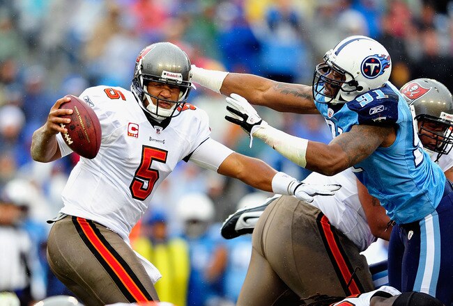 NASHVILLE, TN - NOVEMBER 27:  Jason Jones #91 of the Tennessee Titans pressures quarterback Josh Freeman #5 of the Tampa Bay Buccaneers during play at LP Field on November 27, 2011 in Nashville, Tennessee.  (Photo by Grant Halverson/Getty Images)