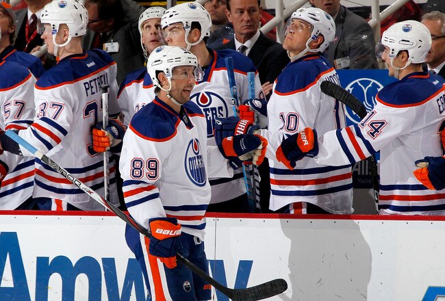 DETROIT, MI - FEBRUARY 08:  Sam Gagner #89 of the Edmonton Oilers celebrates a second period goal with teammates while playing the Detroit Red Wings at Joe Louis Arena on February 8, 2012 in Detroit, Michigan. (Photo by Gregory Shamus/Getty Images)