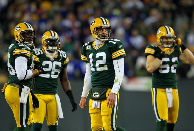 GREEN BAY, WI - JANUARY 15:  Aaron Rodgers #12 of the Green Bay Packers looks on in the third quarter against the New York Giants during their NFC Divisional playoff game at Lambeau Field on January 15, 2012 in Green Bay, Wisconsin.  (Photo by Jamie Squire/Getty Images)