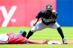 ATLANTA, GA - JULY 31:  Jose Constanza #17 of the Atlanta Braves slides safely back into second base as Hanley Ramirez #2 of the Florida Marlins bobbles the catch in the first inning at Turner Field on July 31, 2011 in Atlanta, Georgia.  (Photo by Kevin C. Cox/Getty Images)