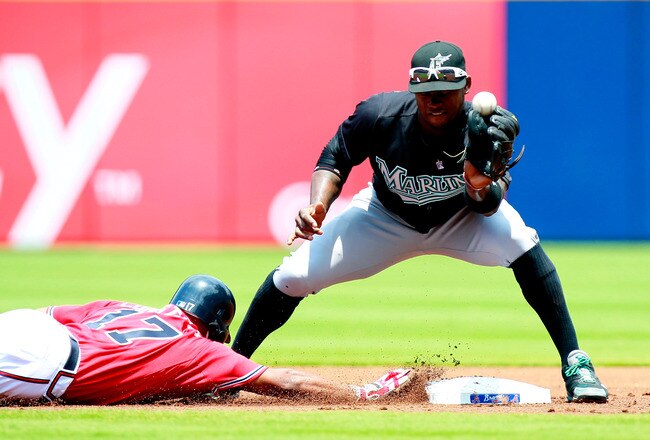 ATLANTA, GA - JULY 31:  Jose Constanza #17 of the Atlanta Braves slides safely back into second base as Hanley Ramirez #2 of the Florida Marlins bobbles the catch in the first inning at Turner Field on July 31, 2011 in Atlanta, Georgia.  (Photo by Kevin C. Cox/Getty Images)
