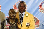 CANTON, OH - AUGUST 6:  Former St. Louis Rams running back Marshal Faulk (R) and his agent Rocky Arceneaux pose with Faulk's bust at the Enshrinement Ceremony for the Pro Football Hall of Fame on August 6, 2011 in Canton, Ohio.  (Photo by Jason Miller/Getty Images)