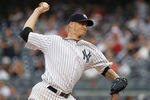NEW YORK, NY - AUGUST 09:  A.J. Burnett #34 of the New York Yankees delivers a pitch in the first inning agaimst the Los Angeles Angels of Anaheim on August 09, 2011 at Yankee Stadium in the Bronx borough of New York City.  (Photo by Mike Stobe/Getty Images)