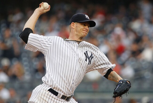 NEW YORK, NY - AUGUST 09:  A.J. Burnett #34 of the New York Yankees delivers a pitch in the first inning agaimst the Los Angeles Angels of Anaheim on August 09, 2011 at Yankee Stadium in the Bronx borough of New York City.  (Photo by Mike Stobe/Getty Images)