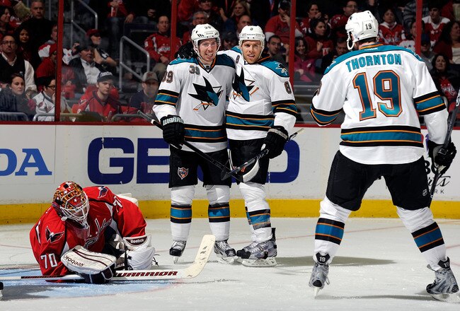 WASHINGTON, DC - FEBRUARY 13:  Joe Pavelski #8 of the San Jose Sharks celebrates with Logan Couture #39 and Joe Thornton #19 after scoring in the second period against the Washington Capitals at the Verizon Center on February 13, 2012 in Washington, DC.  (Photo by Greg Fiume/Getty Images)