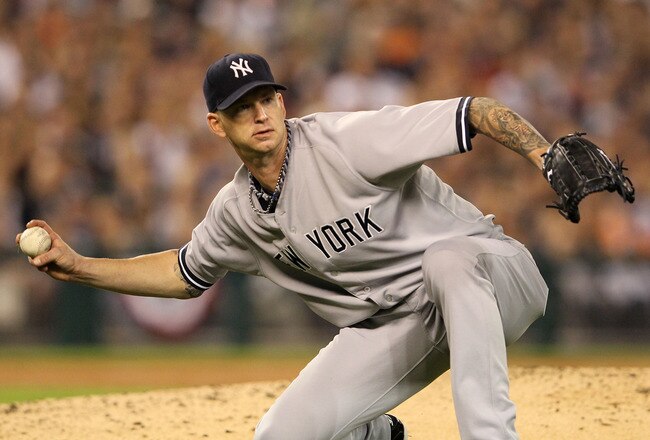 DETROIT, MI - OCTOBER 04:  A.J. Burnett #34 of the New York Yankees throws to first for the final out of the fifth inning on a ground ball from Delmon Young #21 of the Detroit Tigers during Game Four of the American League Division Series at Comerica Park on October 4, 2011 in Detroit, Michigan.  (Photo by Leon Halip/Getty Images)