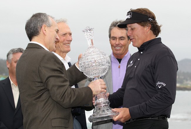PEBBLE BEACH, CA - FEBRUARY 12:  Phil Mickelson smiles as he is awarded the tournament trophy after winning with an eight-under-par 64 during the AT&T Pebble Beach National Pro-Am at Pebble Beach Golf Links on February 12, 2012 in Pebble Beach, California.  (Photo by Ezra Shaw/Getty Images)