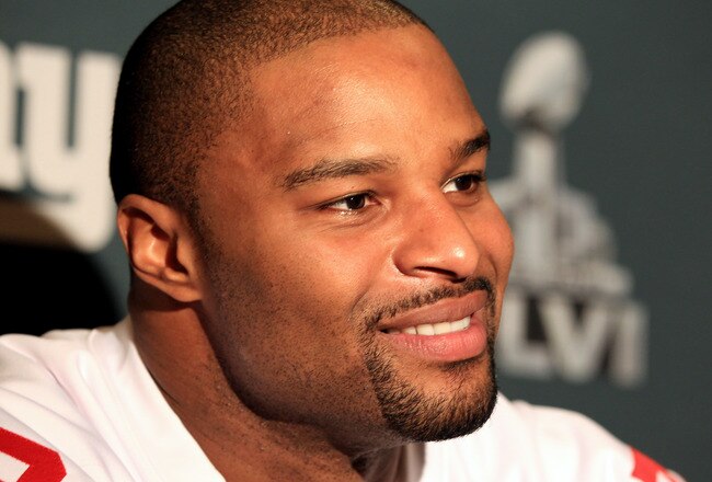 INDIANAPOLIS, IN - FEBRUARY 02:  Osi Umenyiora #72 of the New York Giants answers questions from the press during a media availability session for Super Bowl XLVI at the Indianapolis Downtown Marriott on February 2, 2012 in Indianapolis, Indiana.  (Photo by Scott Halleran/Getty Images)