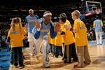 DENVER - NOVEMBER 17:  J. R. Smith #1 of the Denver Nuggets high fives young fans before facing the New York Knicks at the Pepsi Center November 17, 2007 in Denver, Colorado. The Nuggets defeated the Knicks 115-83.  (Photo by Doug Pensinger/Getty Images)