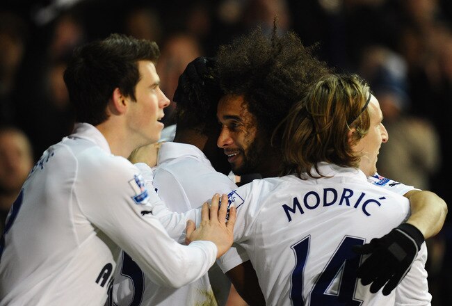 LONDON, ENGLAND - FEBRUARY 11:  Gareth Bale and Luka Modric of Spurs celebrate with goal scorer Benoit Assou-Ekotto of Spurs after he scored the opening goal during the Barclays Premier League match between Tottenham Hotspur and Newcastle United at White Hart Lane on February 11, 2012 in London, England.  (Photo by Mike Hewitt/Getty Images)