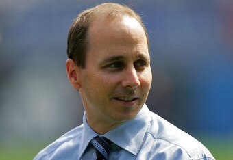 NEW YORK - APRIL 11:  General manager Brian Cashman of the New York Yankees stands on the field during batting practice before the home opener against the Kansas City Royals at Yankee Stadium on April 11, 2006 in the Bronx borough of New York City.  (Photo by Ezra Shaw/Getty Images)
