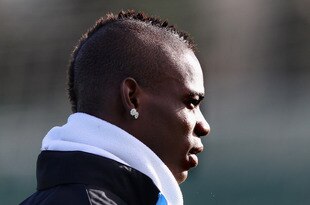 MANCHESTER, ENGLAND - FEBRUARY 15:  Mario Balotelli of Manchester City looks on during a training session held ahead of their UEFA Europa League match against Porto at the Carrington Training Complex on February 15, 2012 in Manchester, England.  (Photo by Alex Livesey/Getty Images)