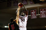 PHILADELPHIA, PA - DECEMBER 18:  Micheal Eric #50 of the Temple Owls attempts a shot against Tim Toler #5 of the Northern Illinois Huskies at the Liacouras Center on December 18, 2010 in Philadelphia, Pennsylvania.  (Photo by Chris Chambers/Getty Images)