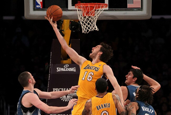 LOS ANGELES, CA - NOVEMBER 09:  Pau Gasol #16 of the Los Angeles Lakers shoots between Darko Milicic #31 and Kevin Love #42 of the Minnesota Timberwolves at Staples Center on November 9, 2010 in Los Angeles, California.   NOTE TO USER: User expressly acknowledges and agrees that, by downloading and or using this photograph, User is consenting to the terms and conditions of the Getty Images License Agreement.  (Photo by Stephen Dunn/Getty Images)