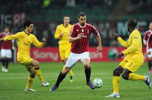 MILAN, ITALY - FEBRUARY 15:  Zlatan Ibrahimovic of AC Milan takes the ball past Mikel Arteta of Arsenal during the UEFA Champions League round of 16 first leg match between AC Milan and Arsenal at Stadio Giuseppe Meazza on February 15, 2012 in Milan, Italy.  (Photo by Shaun Botterill/Getty Images)