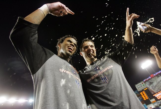 NEW YORK - SEPTEMBER 18:  Jose Reyes #7 and David Wright of the New York Mets celebrate on the field after beating the Florida Marlins on September 18, 2006 at Shea Stadium in the Flushing neighborhood of the Queens borough of New York City.  With the win the Mets clinched the National League East title.  (Photo by Nick Laham/Getty Images)