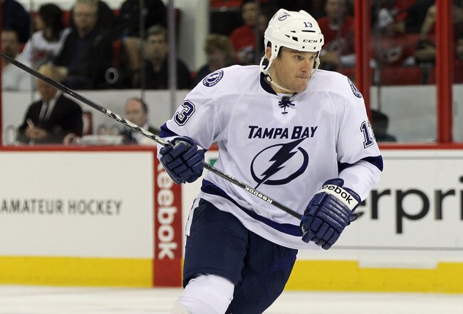RALEIGH, NC - OCTOBER 07:  Pavel Kubina #13 of the Tampa Bay Lightning skates against the Carolina Hurricanes at the RBC Center on October 7, 2011 in Raleigh, North Carolina. The Lightning defeated the Hurricanes 5-1.  (Photo by Bruce Bennett/Getty Images)