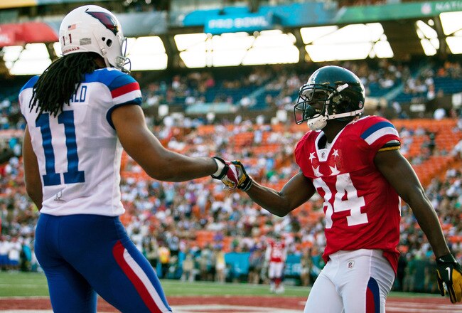 HONOLULU, HI - JANUARY 29:  Larry Fitzgerald #11 of the Arizona Cardinals shakes hands with Antonio Brown #84 of the Pittsburg Steelers during the 2012 NFL Pro Bowl at Aloha Stadium on January 29, 2012 in Honolulu, Hawaii.  (Photo by Kent Nishimura/Getty Images)