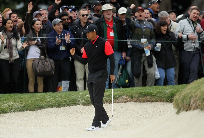 PEBBLE BEACH, CA - FEBRUARY 12:  Tiger Woods reacts to his shot from a greenside bunker on the 12th hole during the final round of the AT&T Pebble Beach National Pro-Am at Pebble Beach Golf Links on February 12, 2012 in Pebble Beach, California.  (Photo by Jeff Gross/Getty Images)