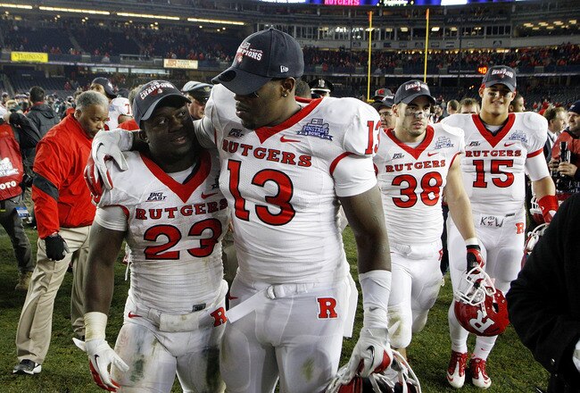 NEW YORK - DECEMBER 30:  Jawan Jamison #23 and Paul Hamersma #13 of the Rutgers Scarlet Knights celebrate a win over the Iowa State Cyclones in the New Era Pinstripe Bowl at Yankee Stadium on December 30, 2011 in the Bronx Borough of New York City.  (Photo by Jeff Zelevansky/Getty Images)