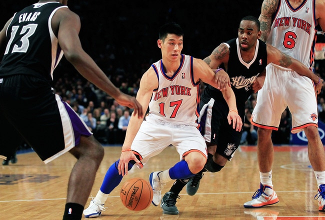 NEW YORK, NY - FEBRUARY 15:  Jeremy Lin #17 of the New York Knicks drives past Marcus Thornton #23 of the Sacramento Kings at Madison Square Garden on February 15, 2012 in New York City. NOTE TO USER: User expressly acknowledges and agrees that, by downloading and/or using this Photograph, user is consenting to the terms and conditions of the Getty Images License Agreement.  (Photo by Chris Trotman/Getty Images)