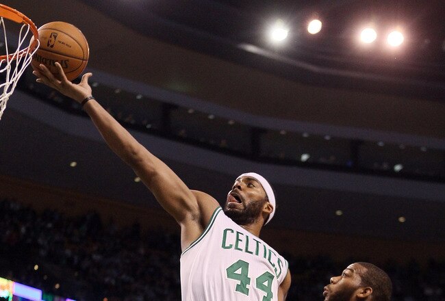 BOSTON, MA - FEBRUARY 15:  Chris Wilcox #44 of the Boston Celtics takes a shot over Greg Monroe #10 of the Detroit Pistons on February 15, 2012 at TD Garden in Boston, Massachusetts. NOTE TO USER: User expressly acknowledges and agrees that, by downloading and or using this photograph, User is consenting to the terms and conditions of the Getty Images License Agreement.  (Photo by Elsa/Getty Images)