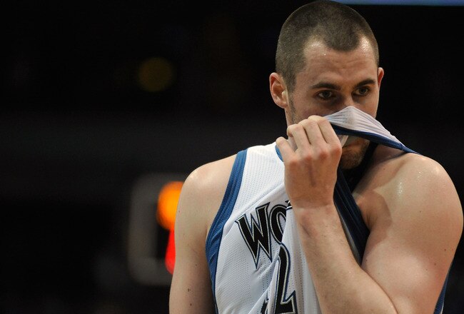 MINNEAPOLIS, MN - APRIL 1: Kevin Love #42 of the Minnesota Timberwolves reacts to a foul during the second half of a basketball game against the Miami Heat at Target Center on April 1, 2011 in Minneapolis, Minnesota. Heat defeated the Timberwolves 111- 92. NOTE TO USER: User expressly acknowledges and agrees that, by downloading and or using this Photograph, user is consenting to the terms and conditions of the Getty Images License Agreement.  (Photo by Hannah Foslien /Getty Images)