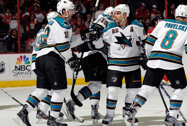 WASHINGTON, DC - FEBRUARY 13:  Patrick Marleau #12 of the San Jose Sharks celebrates with Dan Boyle #22 after scoring in the second period against the Washington Capitals at the Verizon Center on February 13, 2012 in Washington, DC.  San Jose won the game 5-3. (Photo by Greg Fiume/Getty Images)