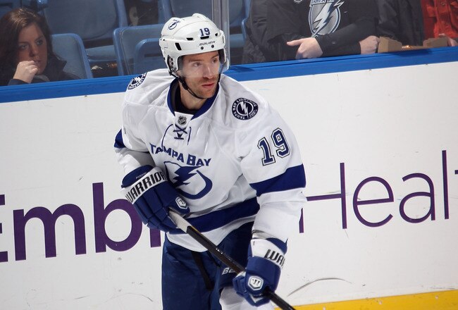 UNIONDALE, NY - DECEMBER 06:  Dominic Moore #19 of the Tampa Bay Lightning skates against the New York Islanders at the Nassau Veterans Memorial Coliseum on December 6, 2011 in Uniondale, New York. The Islanders defeated the Lightning 5-1.  (Photo by Bruce Bennett/Getty Images)