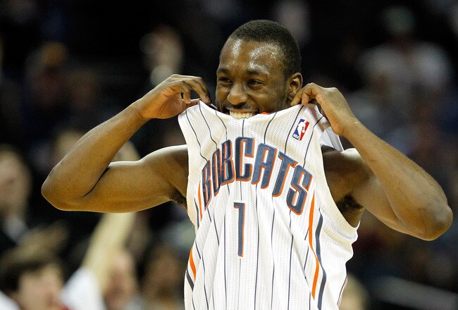 CHARLOTTE, NC - JANUARY 14:  Kemba Walker #1 of the Charlotte Bobcats celebrates after a basket against the Golden State Warriors during their game at Time Warner Cable Arena on January 14, 2012 in Charlotte, North Carolina.  NOTE TO USER: User expressly acknowledges and agrees that, by downloading and or using this photograph, User is consenting to the terms and conditions of the Getty Images License Agreement.  (Photo by Streeter Lecka/Getty Images)