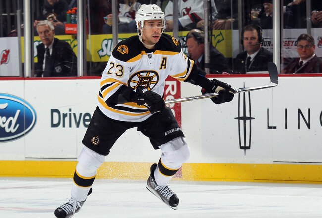 NEWARK, NJ - JANUARY 19: Chris Kelly #23 of the Boston Bruins skates against the New Jersey Devils at the Prudential Center on January 19, 2012 in Newark, New Jersey.  (Photo by Bruce Bennett/Getty Images)