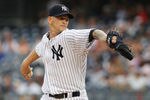 NEW YORK, NY - AUGUST 09:  A.J. Burnett #34 of the New York Yankees delivers a pitch in the first inning agaimst the Los Angeles Angels of Anaheim on August 09, 2011 at Yankee Stadium in the Bronx borough of New York City.  (Photo by Mike Stobe/Getty Images)