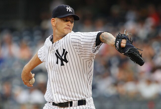 NEW YORK, NY - AUGUST 09:  A.J. Burnett #34 of the New York Yankees delivers a pitch in the first inning agaimst the Los Angeles Angels of Anaheim on August 09, 2011 at Yankee Stadium in the Bronx borough of New York City.  (Photo by Mike Stobe/Getty Images)