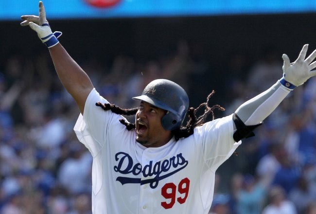 LOS ANGELES, CA - APRIL 18:  Manny Ramirez #99 of the Los Angeles Dodgers celebrates after hitting a two-run homerun in the eighth inning against the San Francisco Giants at Dodger Stadium on April 18, 2010 in Los Angeles, California. The Dodgers defeated the Giants 2-1.  (Photo by Jeff Gross/Getty Images)