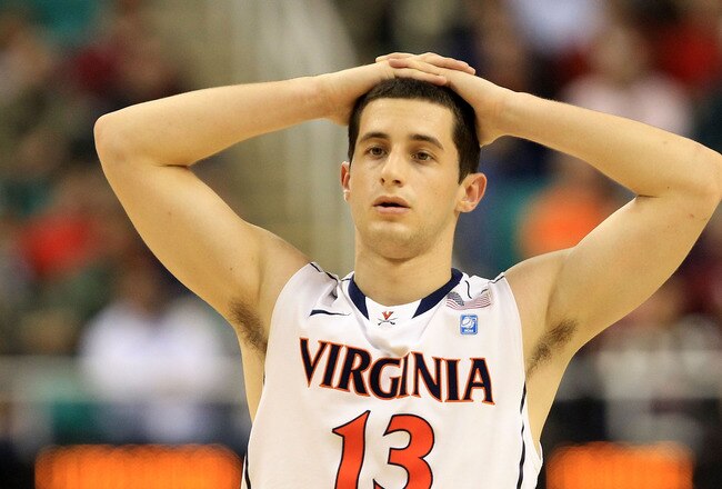 GREENSBORO, NC - MARCH 10:  Sammy Zeglinski #13 of the Virginia Cavaliers reacts in overtime during the first round of the 2011 ACC men's basketball tournament at the Greensboro Coliseum on March 10, 2011 in Greensboro, North Carolina.  Miami won 69-62 in overtime. (Photo by Streeter Lecka/Getty Images)