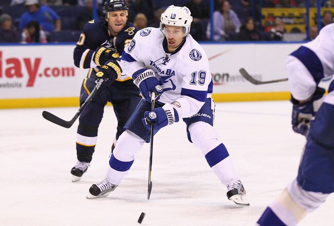 ST. LOUIS, MO - NOVEMBER 12: Dominic Moore #19 of the Tampa Bay Lightning moves the puck un ice against the St. Louis Blues at the Scottrade Center  on November 12, 2011 in St. Louis, Missouri.  The Blues beat the Lighning 3-0.  (Photo by Dilip Vishwanat/Getty Images)