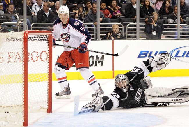 LOS ANGELES, CA - FEBRUARY 01:  Jonathan Quick #32 of the Los Angeles Kings and Antoine Vermette #50 of the Columbus Blue Jackets look at the goal of Colton Gillies #9 of the Columbus Blue Jackets for a 2-2 tie during the the third period at Staples Center on February 1, 2012 in Los Angeles, California.  (Photo by Harry How/Getty Images)