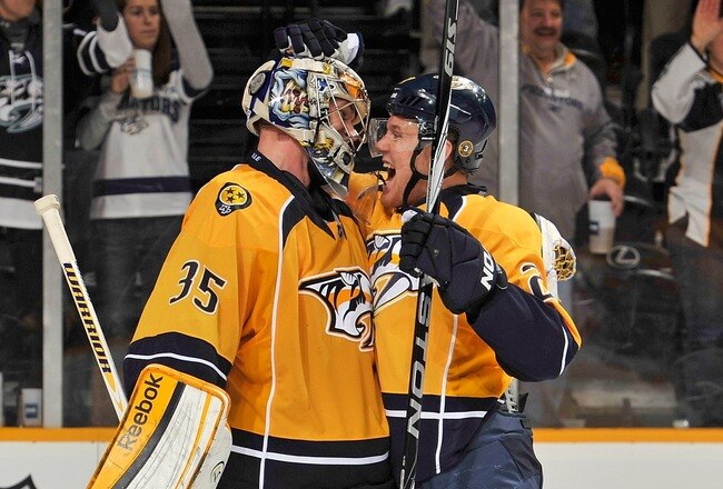 NASHVILLE, TN - FEBRUARY 04: Patric Hornqvist #27 of the Nashville Predators congratulates teammate goalie Pekka Rinne #35 on defeating the St Louis Blues at the Bridgestone Arena on February 4, 2012 in Nashville, Tennessee.  (Photo by Frederick Breedon/Getty Images)
