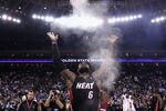 OAKLAND, CA - JANUARY 10:  LeBron James #6 of the Miami Heat throws chalk in to the air before their game against the Golden State Warriors at Oracle Arena on January 10, 2012 in Oakland, California.  NOTE TO USER: User expressly acknowledges and agrees that, by downloading and or using this photograph, User is consenting to the terms and conditions of the Getty Images License Agreement.  (Photo by Ezra Shaw/Getty Images)
