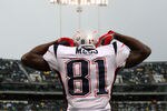 OAKLAND, CA - DECEMBER 14: Randy Moss #81 of the New England Patriots celeberates after scoring a touchdown against the Oakland Raiders during an NFL game on December 14, 2008 at the Oakland-Alameda County Coliseum in Oakland, California.  (Photo by Jed Jacobsohn/Getty Images)