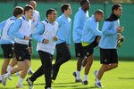 MANCHESTER, ENGLAND - SEPTEMBER 26: Adam Johnson (L), Carlos Tevez (2nd L) and Manchester City team-mates warm up during a training session ahead of their UEFA Champions League Group A match against Bayern Munich on September 26, 2011 in Manchester, United Kingdom.  (Photo by Michael Regan/Getty Images)