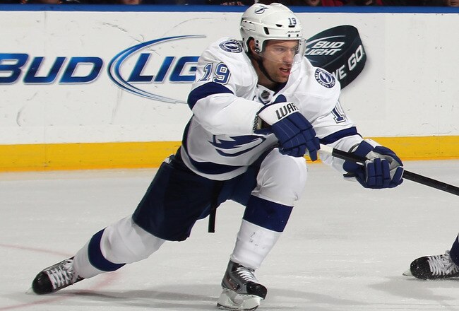 UNIONDALE, NY - DECEMBER 06: Dominic Moore #19 of the Tampa Bay Lightning skates against the New York Islanders at the Nassau Veterans Memorial Coliseum on December 6, 2011 in Uniondale, New York. The Islanders defeated the Lightning 5-1.  (Photo by Bruce Bennett/Getty Images)