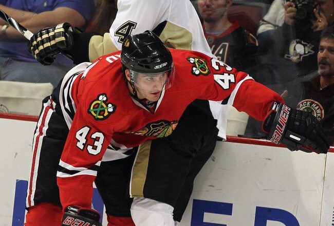 CHICAGO, IL - SEPTEMBER 30: Brandon Saad #43 of the Chicago Blackhawks collides with Zbynek Michalek #4 of the Pittsburgh Penguins along the boards during a preseason game at the United Center on September 30, 2011 in Chicago, Illinois. (Photo by Jonathan Daniel/Getty Images)