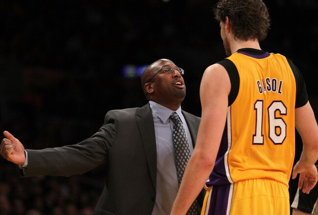 LOS ANGELES, CA - JANUARY 13:  Head coach Mike Brown of the Los Angeles Lakers talks to Pau Gasol #16 in the game with the Cleveland Cavaliers at Staples Center on January 13, 2012 in Los Angeles, California. The Lakers won 97-92.  NOTE TO USER: User expressly acknowledges and agrees that, by downloading and or using this photograph, User is consenting to the terms and conditions of the Getty Images License Agreement.  (Photo by Stephen Dunn/Getty Images)